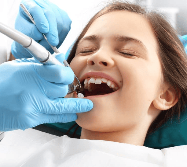 Person rinsing mouth after fluoride treatment